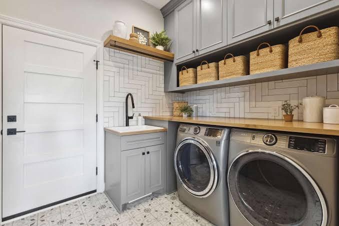 How does plumbing improve the functionality of a laundry room renovation 1